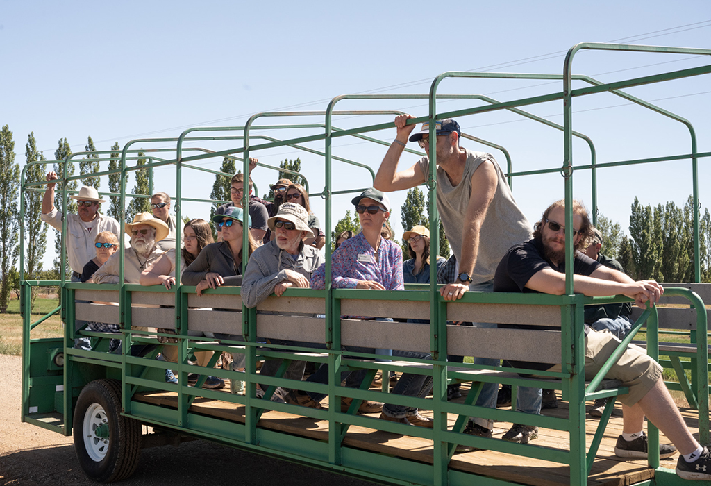 group riding in hay wagon