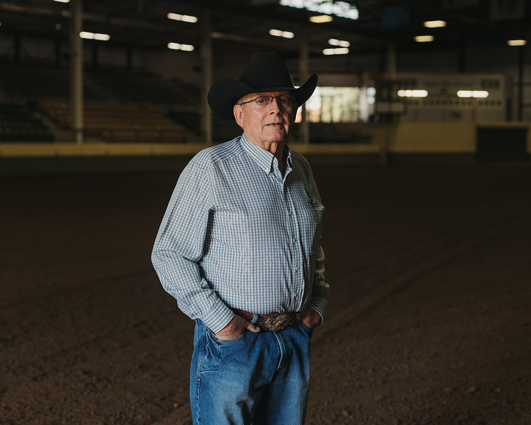 Norm Dalsted stands in the arena of the B.W. Pickett Equine Center at Colorado State University.